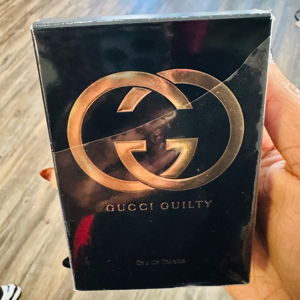 Gucci Fragrance Packaging in Black and Gold